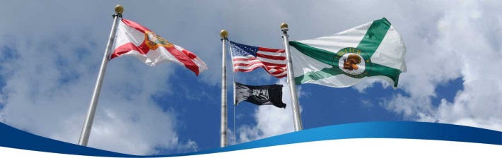 The American, Collier County, Florida and POW flags flying at the county center
